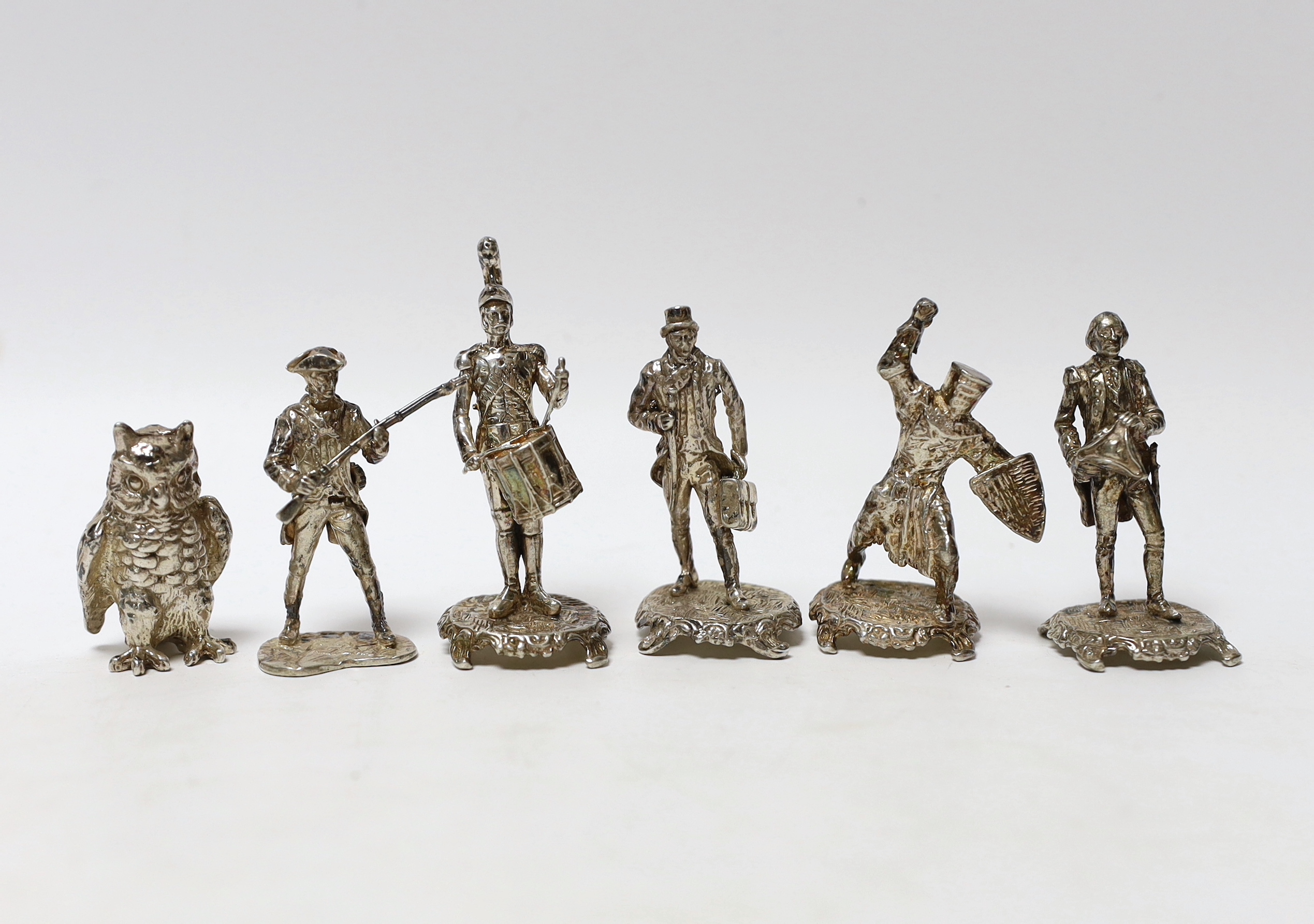 A set of five miniature silver model soldiers, maker SMC, London, 1975, tallest 75mm, together with a silver miniature model of an awl, same date and maker.